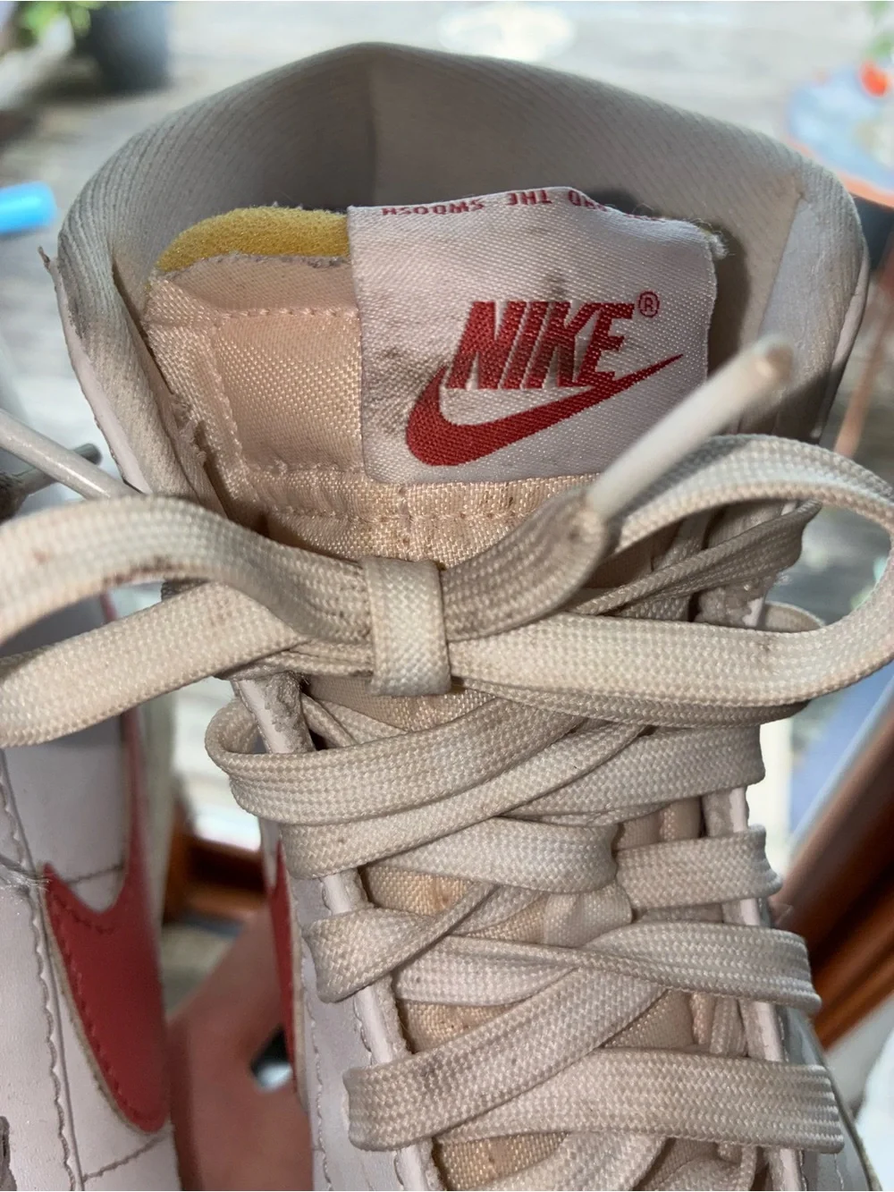 Nike Women's White High-Top Sneakers with Red Swoosh